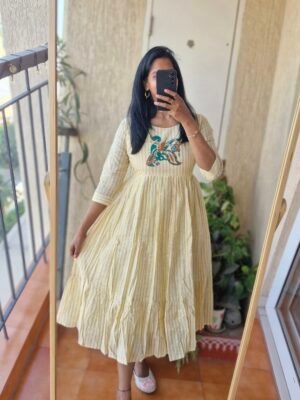 Pastel yellow block print cotton dress.