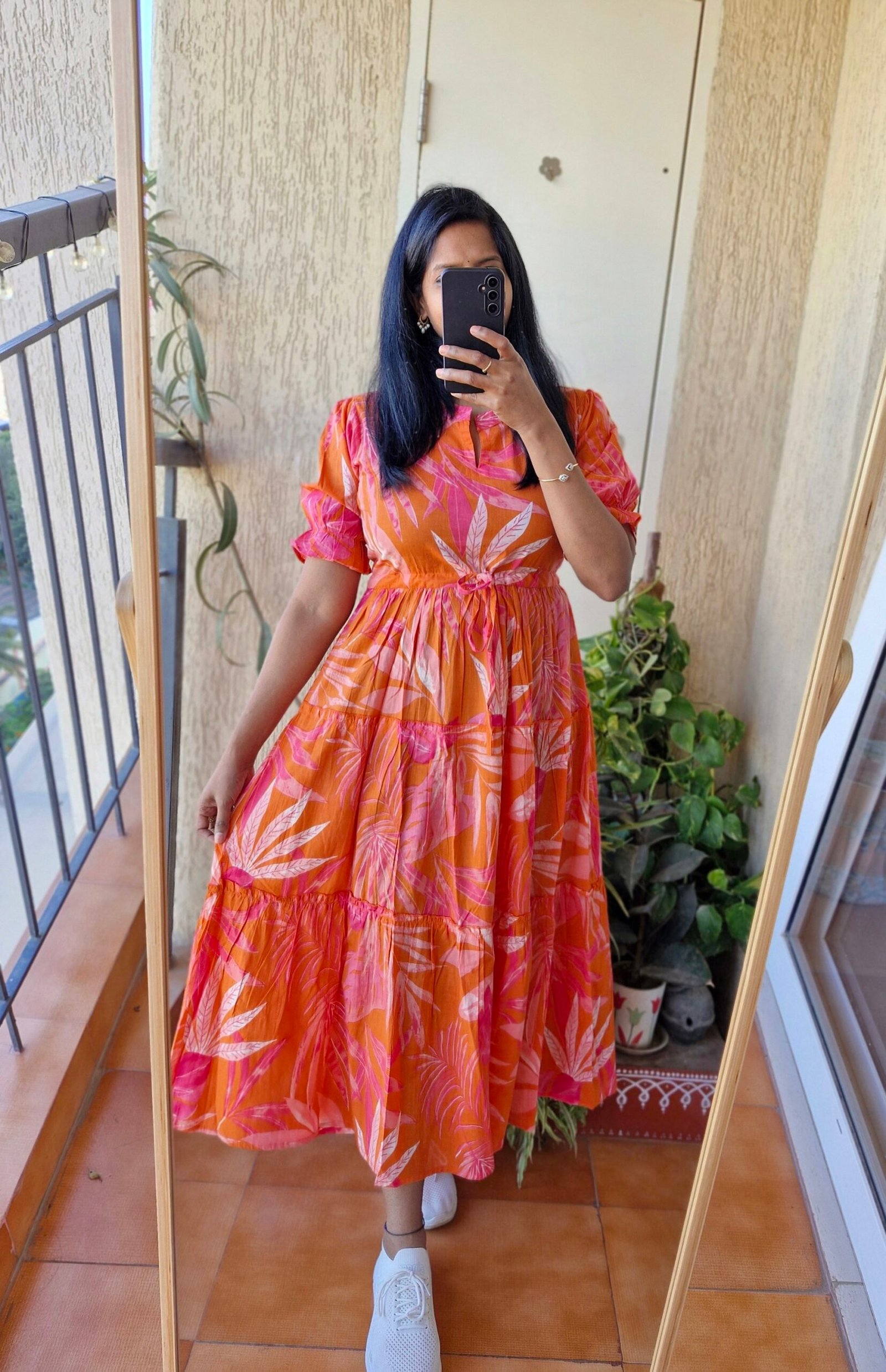 Orange floral three tier cotton dress.