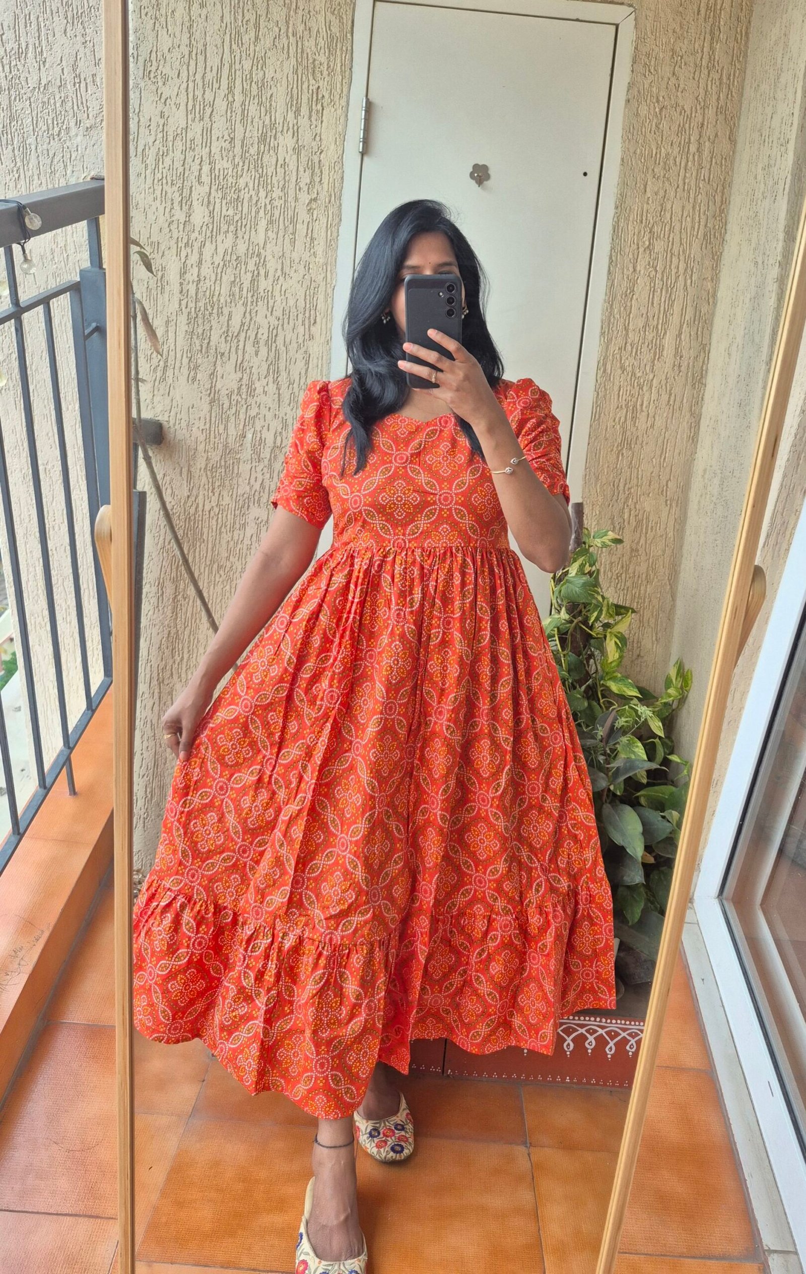 Orange Bandhini cotton dress.