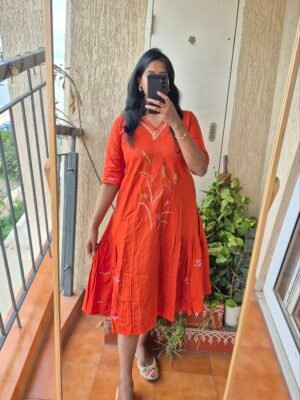Orange embroidered handloom cotton dress.