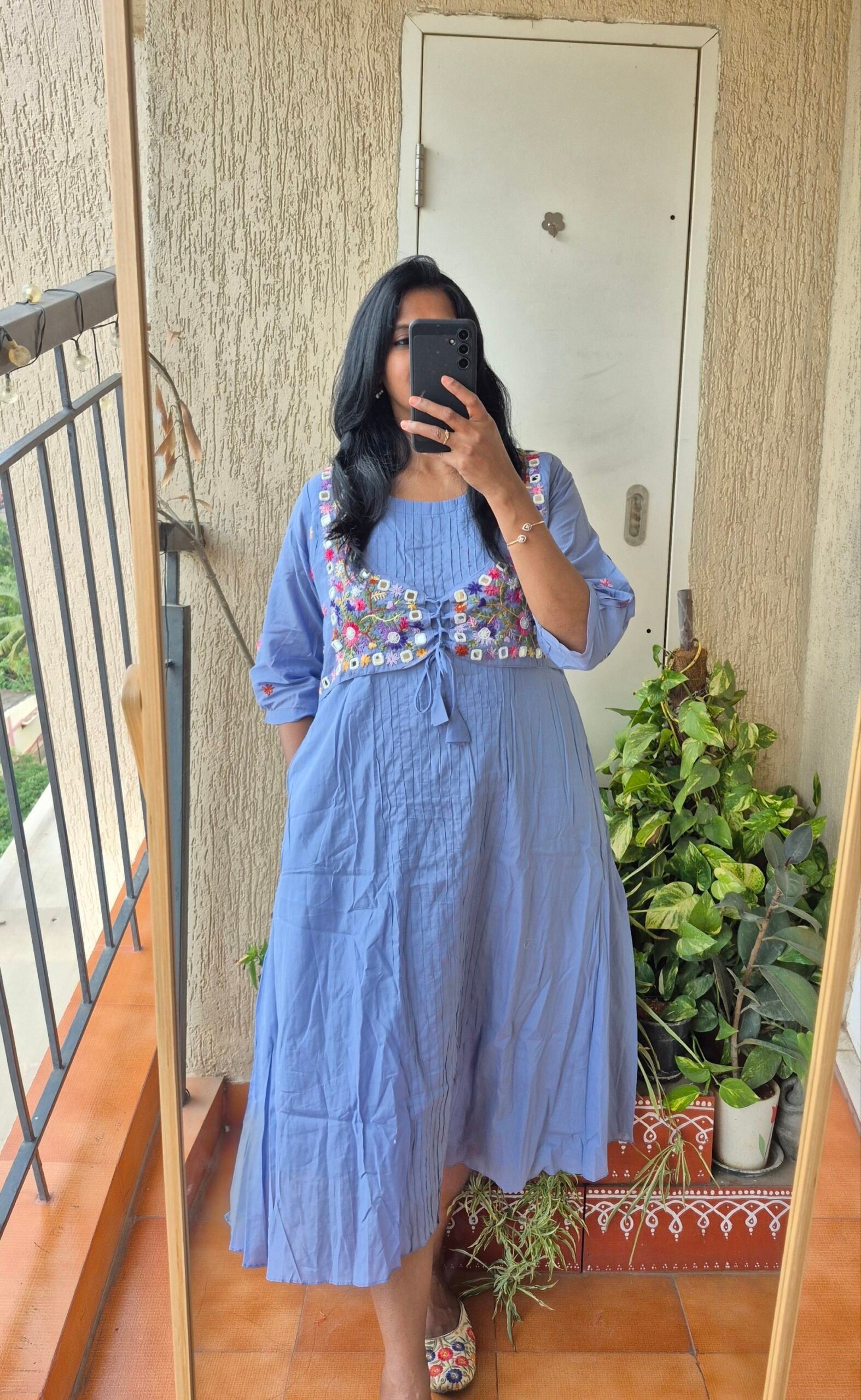 Powder blue jacket embroiderey dress.