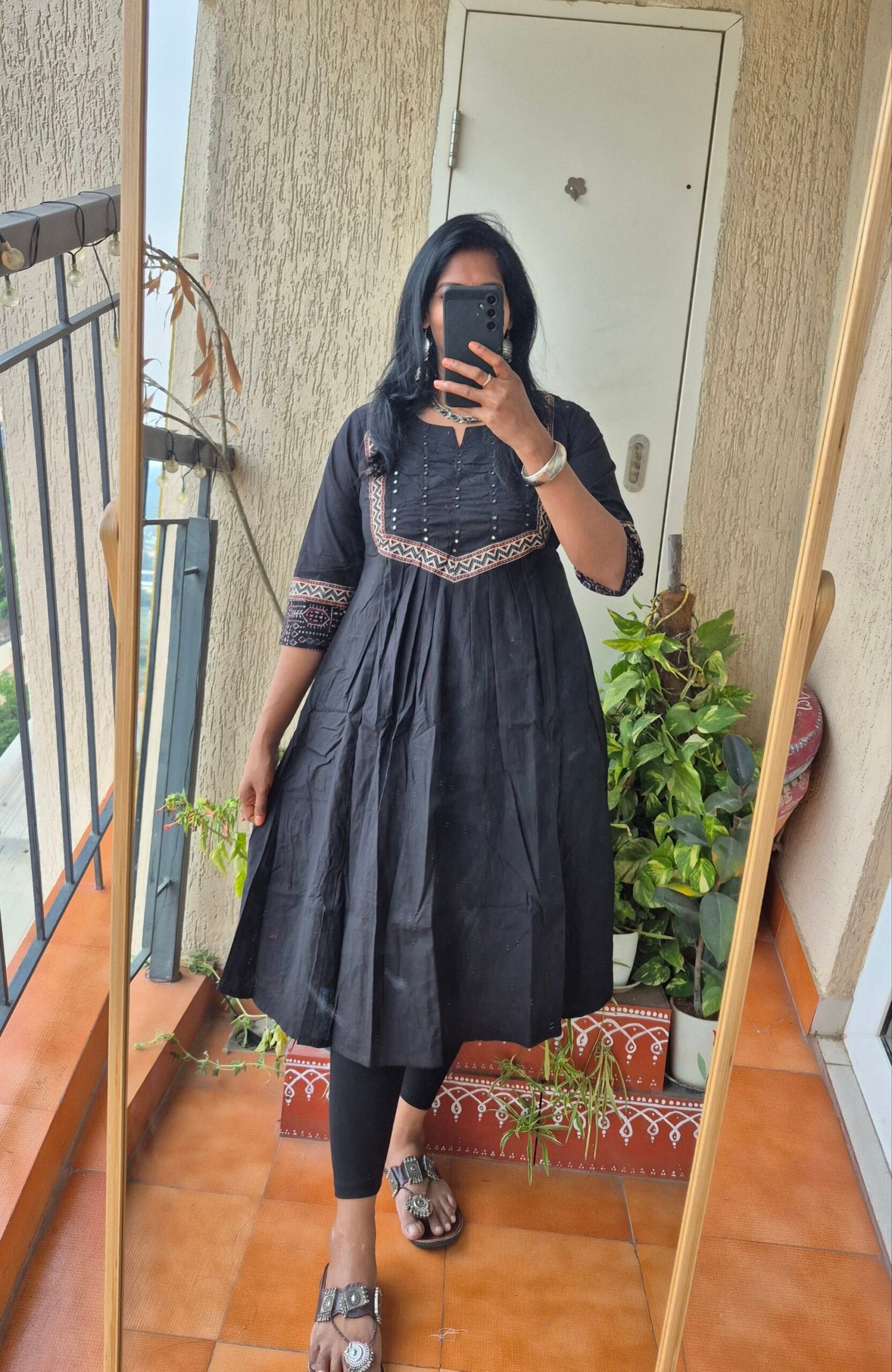 Black cotton mirror work kurti dress.
